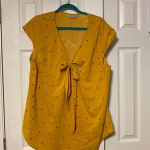 Yellow polka dot blouse with bow.